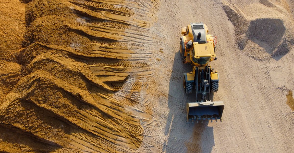 Aerial shot of loader operating on sandy construction site in Ashdod, Israel.