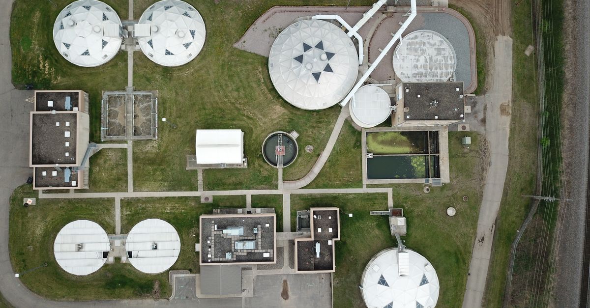 Aerial view of a structured water treatment plant showcasing various components.