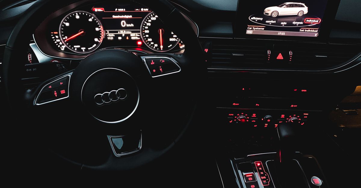 Close-up view of a luxury car's interior showing the dashboard and controls.