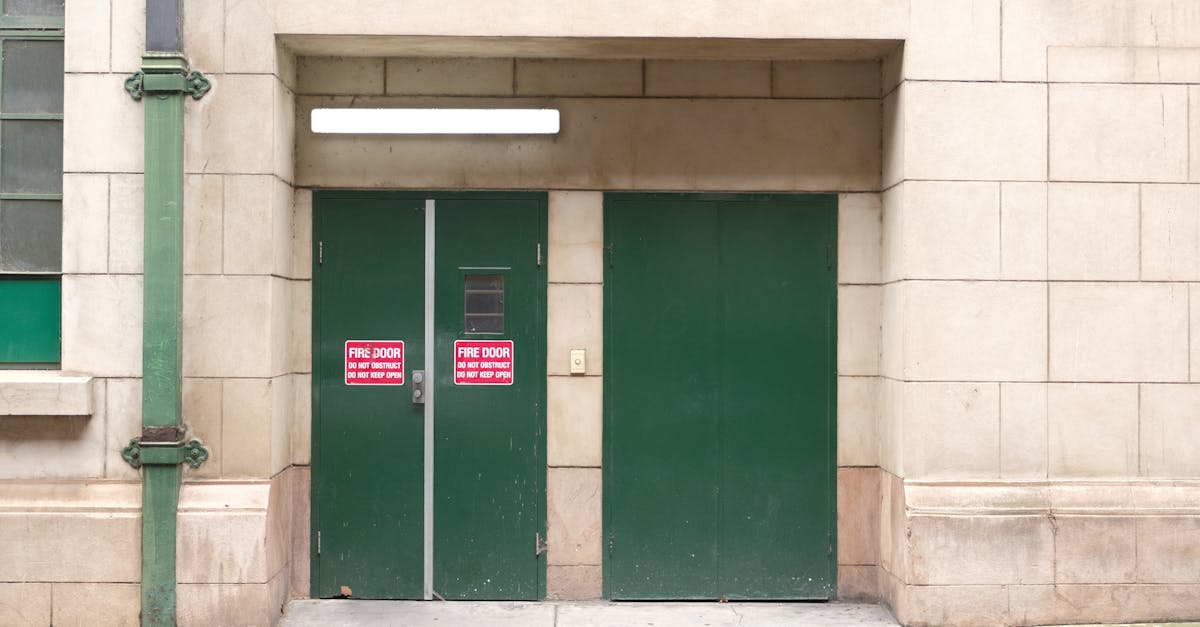 Fire door with warning sign in urban setting, emphasizing safety and compliance.